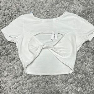 A white cropped tee. Never wore with tags still attached.